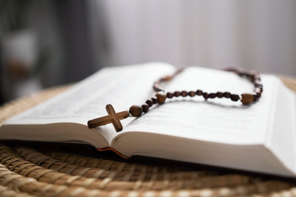 High Angle Open Bible And Rosary Arrangement