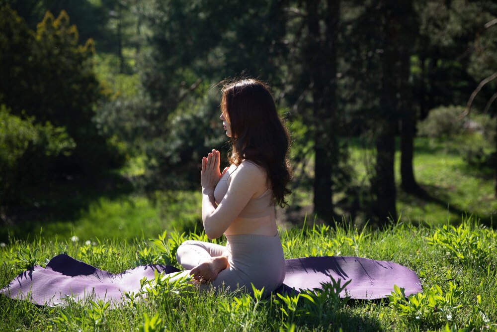 Person Meditating Outdoors, Embracing Gratitude To Enhance Mental Well Being.